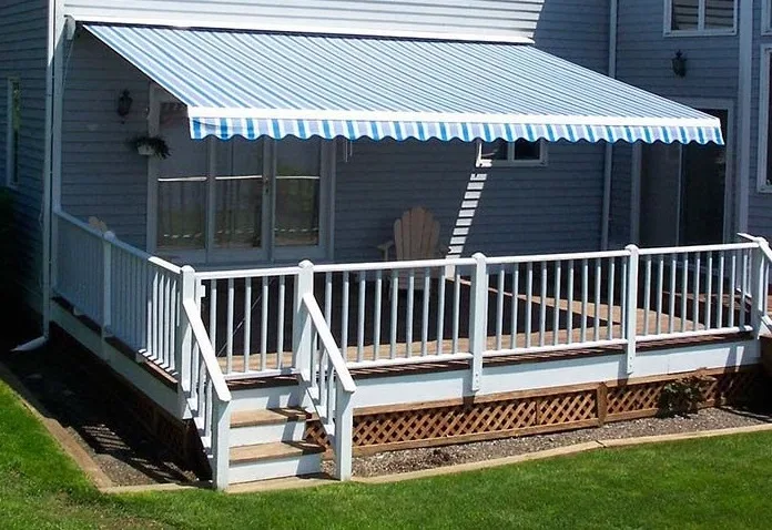 An Eclipse retractable awning over a backyard deck