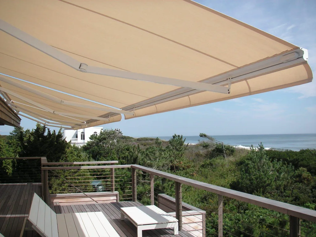 An Eclipse retractable awning extended over a patio dining area