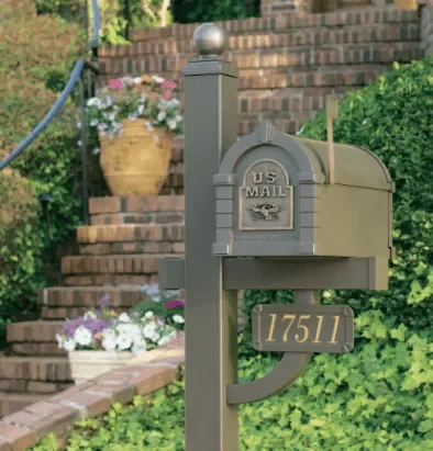 A Gaines post mailbox with an engraved house-number plaque