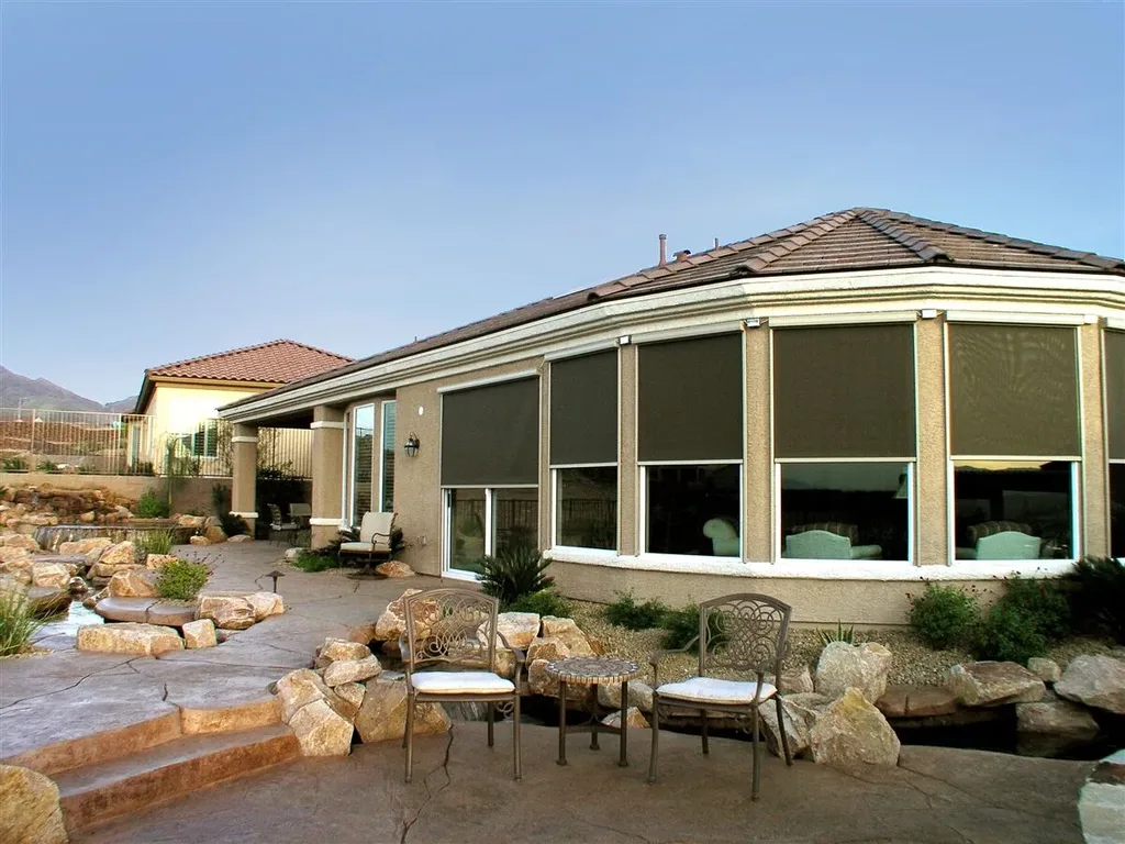 Eclipse exterior solar screens shading a home's windows